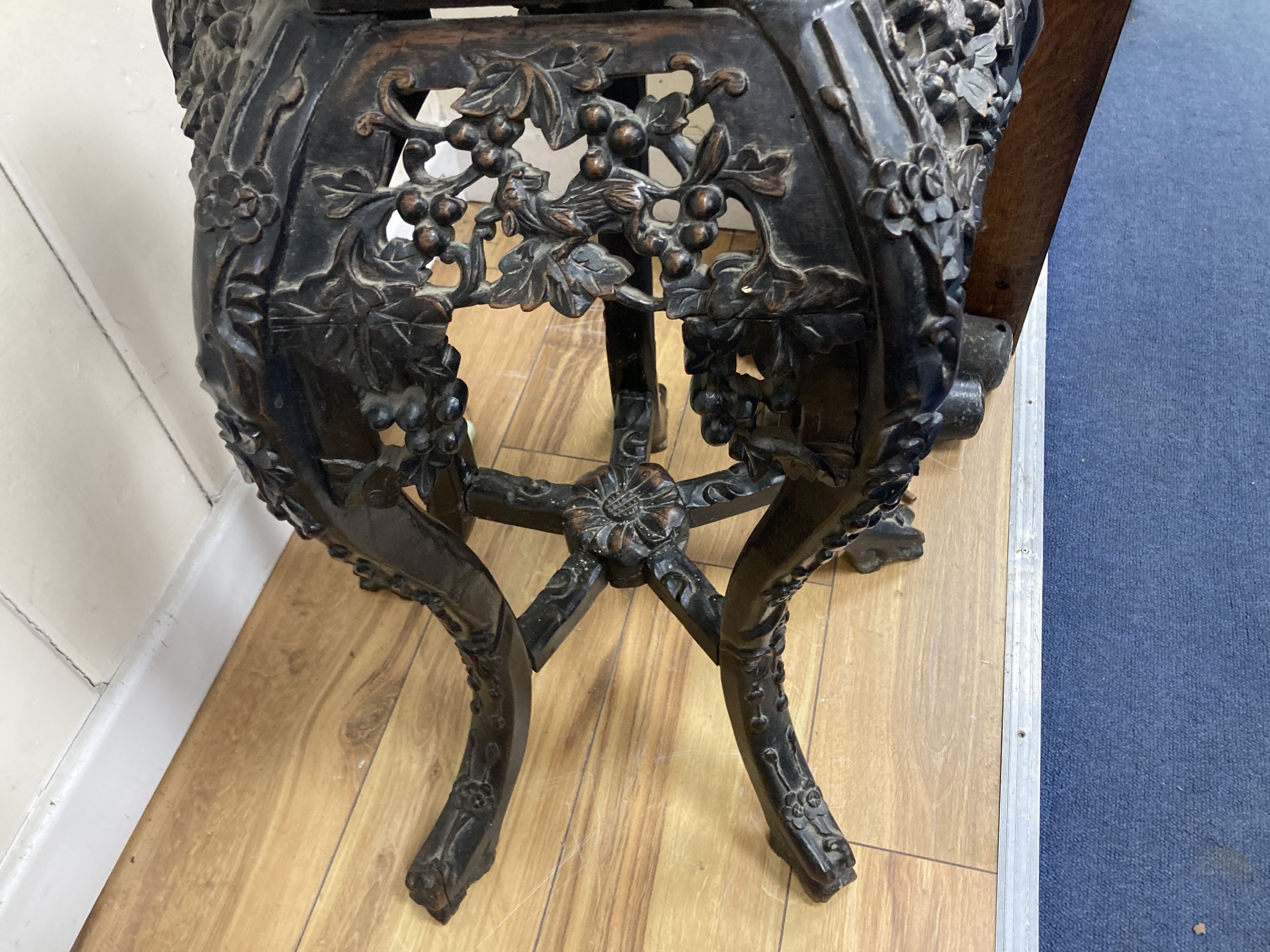 A Chinese marble top carved hardwood jardiniere stand, width 38cm, depth 38cm, height 66cm